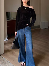A long-sleeved velvet jacket with a slanted hem for women